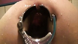 Tight asshole stretched by speculum for a water enema