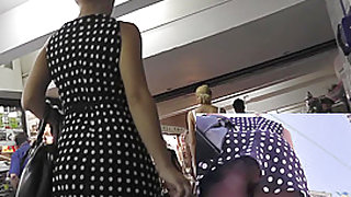 Upskirt cam caught sexy lady in short polka dot skirt