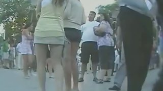 Couple of smokin brunettes in an upskirt public square ass video