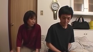 Horny amateur Japanese couple make love in a bedroom