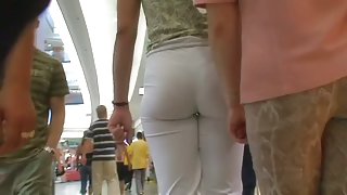 A fan of sexy ass voyeur films the hot butts in white pants