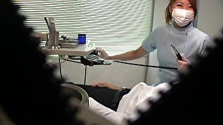 Japanese dentist enjoys stroking a dick of her very lucky patient