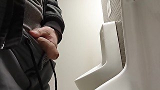 guy piss at public toilet