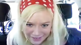 Blue-eyed blonde fingering her butthole in the backseat