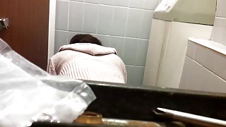 Female bent over the bowl and shot on the toilet cam