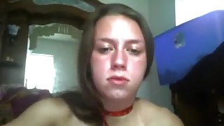 Brunette girl chokes herself, while she masturbates her shaved pussy with a vibrator on her bed.