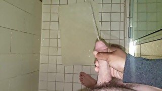 Penis Envy.  Shooting his piss all over in the hotel shower!  Holding his dick while he pees.