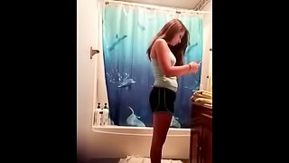 My girlfriend takes a shower without any awareness of the camera.