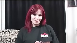 Watch this Curvy Redhead in her corset toying her pussy for you to watch