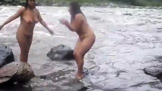 Two indian mature womens  bathing in river naked