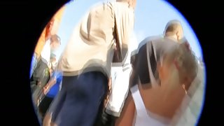 A skilful voyeur upskirt shot made in a large crowd