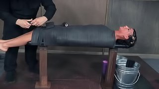 Curvy brunette with natural tits tied on desk in BDSM torture
