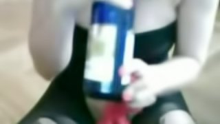 Busty amateur brunette uses a bottle to masturbate in homemade solo