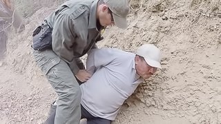 Horny border patrol officer fucks a girl on the dusty ground