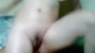 Asian girl with shaved pussy fucks her bf in various positions on the sofa