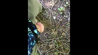 Pissing outdoors wearing a thong