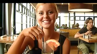 Jessi is drinking cocktail in a cafe showing her sexy legs