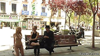 Naked blond hair girl kneeling in public streets
