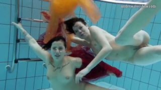 Two hotties submerged underwater