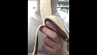Peel and eat a large, black banana by hand.