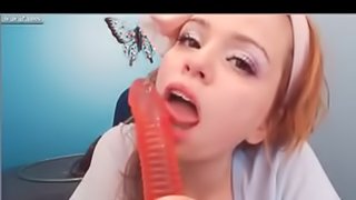 Hot redhead sucks dildo on webcam