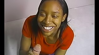 Ebony hussy milks a white cock dry on her face indoors