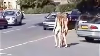 Two naughty blondes running naked in the public park