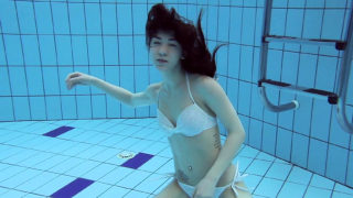 Roxalana Cheh sexy redhead underwater