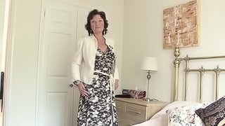 Alluring mature dame in stocking spreading legs in bed