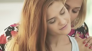 Blonde girl massages redhead senually after having morning coffee.