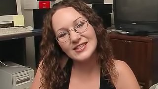 Home office handjob in POV from a cute chick in glasses