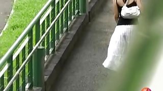 Asian babe in a long white skirt gets street sharked.