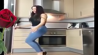 Hot brunette dancing in the kitchen for you