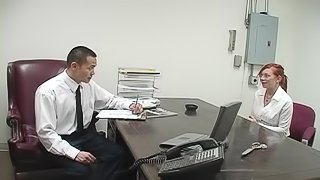 Tattooed redhead sucking her employer's cock in his office