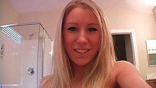 Cute chick fondles her fake tits and chats