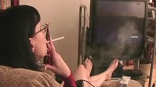 Brunette In Glasses Smoking Heavily In A Reality Shoot