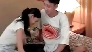 Asian girl toy fucks her man in the asshole