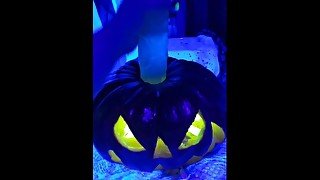 Halloween slut witch conjures up a big pumpkin cock and fucks it like crazy