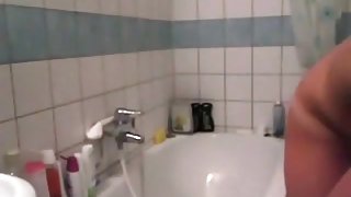 Hot blonde masturbates her pussy and ass with a toy in the bathroom