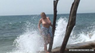 Busty teen Malina get wetting in waves