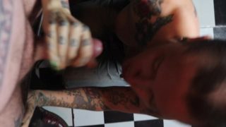 Preview: Shaved head punk girl gets on her knees and gives tattooed punk guy a blowjob
