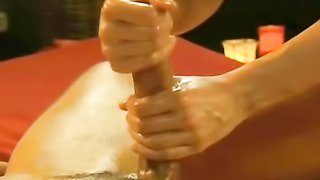 Cute brunette vixen gives a skillful oil cock massage
