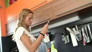 Kinky teen with gorgeous natural tits playing with her tight pussy in her kitchen