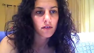 Busty curly haired Brazil camsluts fingers her pussy