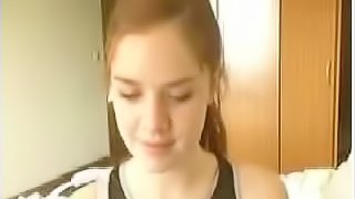 Homemade video of a redhead teen girl exposing her big natural boobs