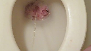 Throwing pink panties into the toilet bowl and pissing!