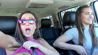 Chicks making out lustily in the car and eating wet snatch