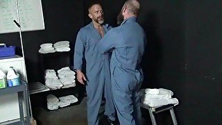 Two prison inmates get down and dirty in the laundry room