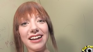Gorgeous redhead with nice big tits enjoying a hardcore glory hole fuck