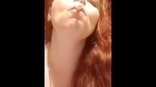 Smoking and balloon fetish teaser with sexy redhead milf